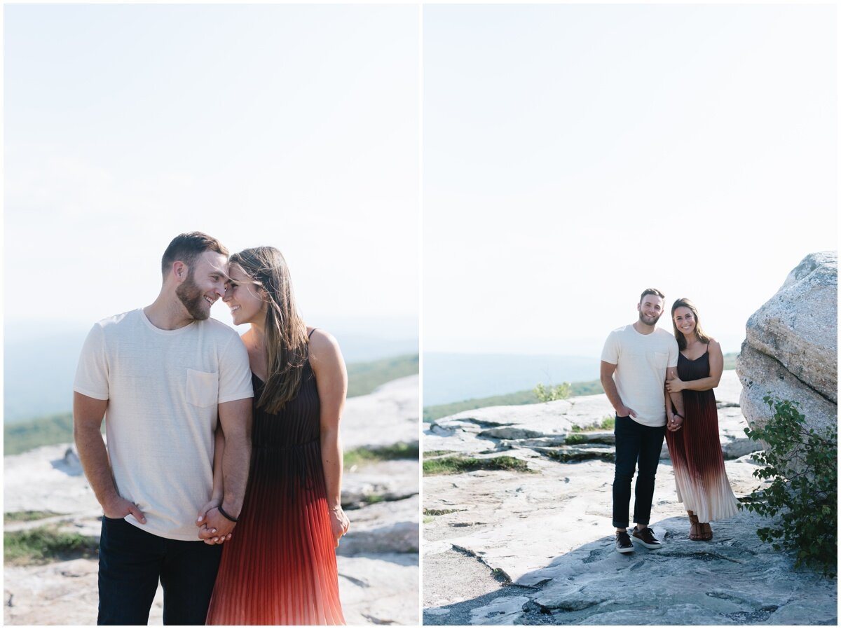 Couple holding hands with heads touching | Couple holding hands during Minnewaska State Park engagement session | NKB Photo