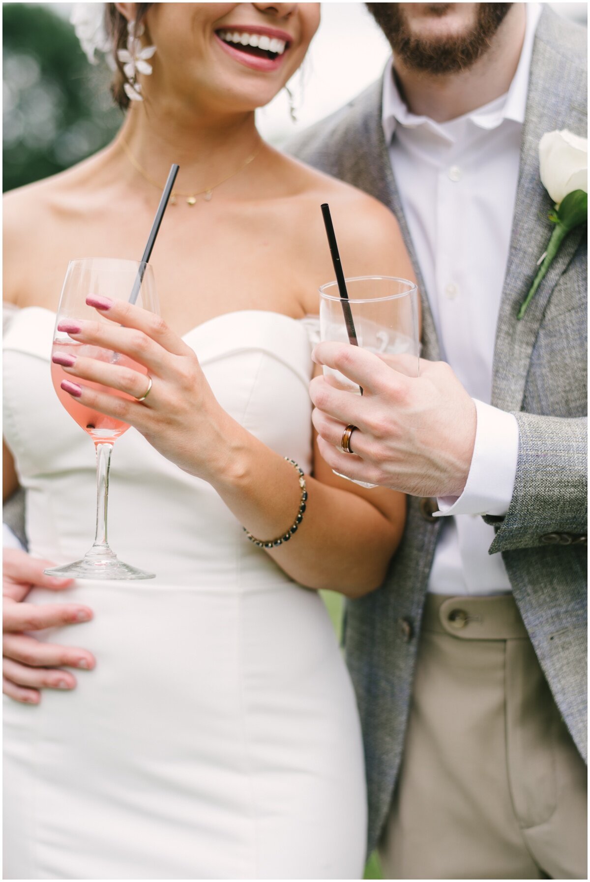  bride and groom toasting cocktails during private estate wedding 