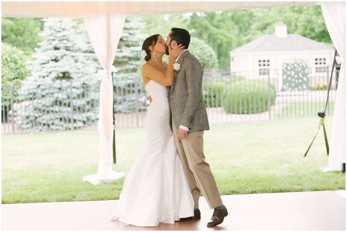  bride and groom kissing at private estate wedding 