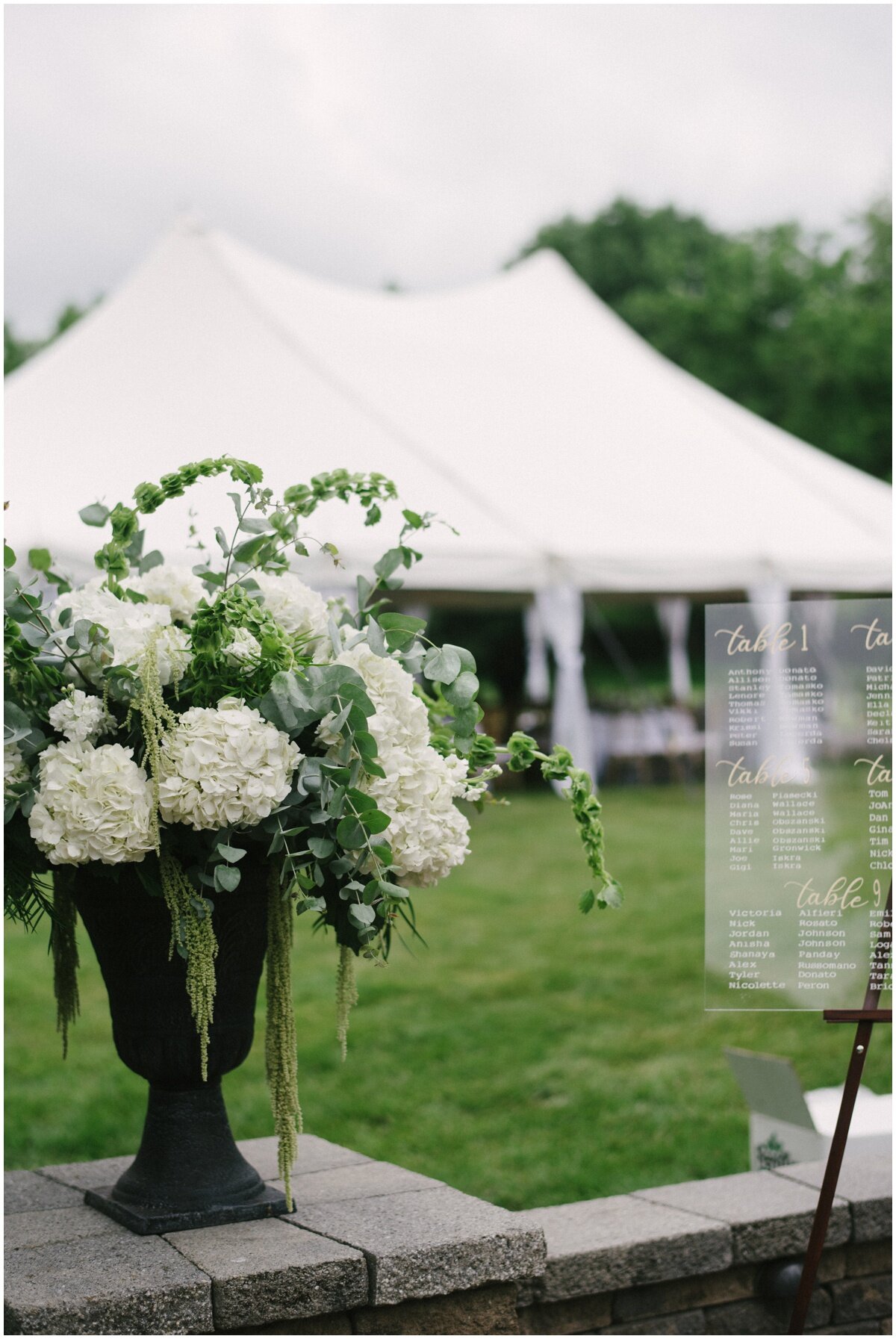  White wedding floral sin urn, outdoor reception at  private estate wedding 