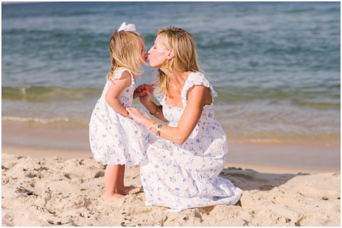 Mom and daughter kissing during family beach session | NKB Photo
