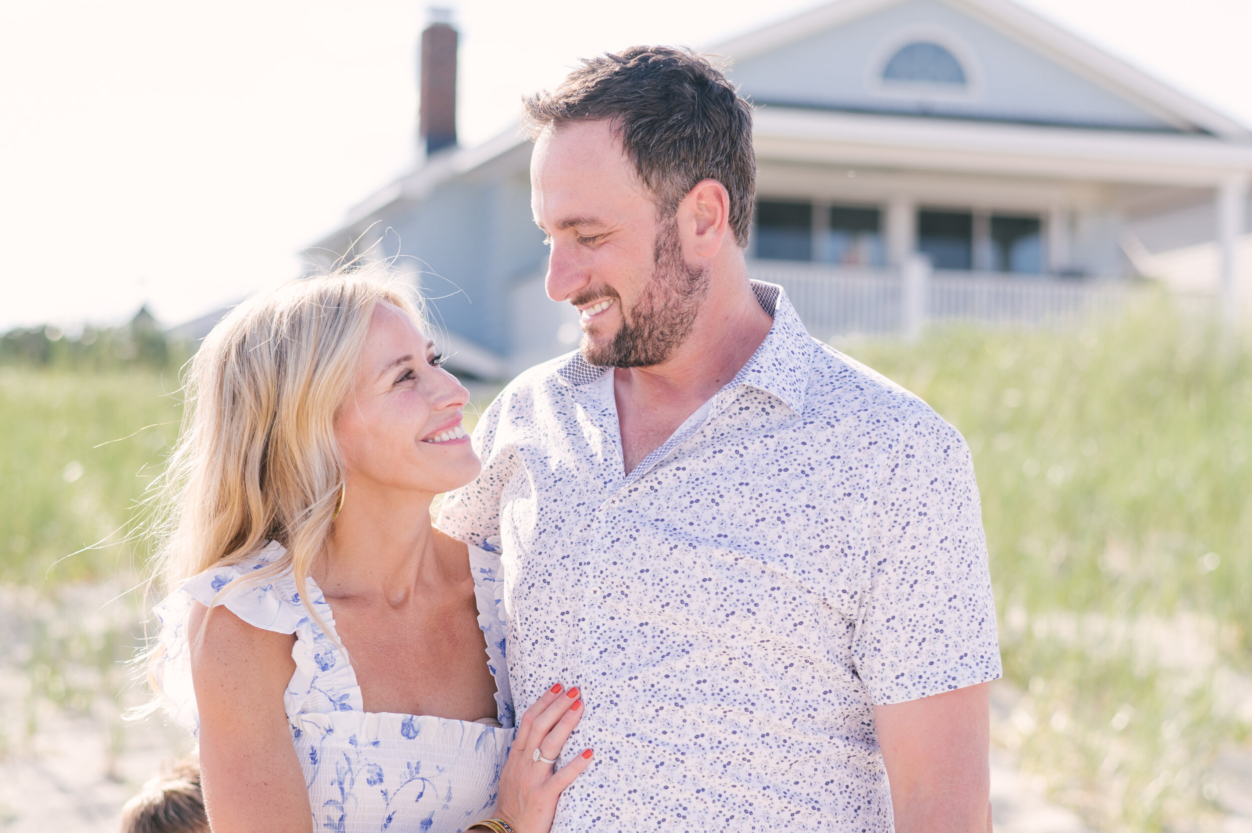 Husband and wife looking at each other during beach photos | NKB Photo