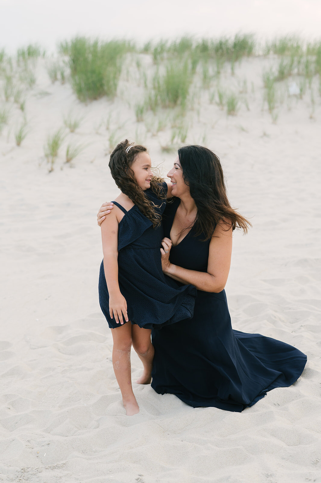 Beach photo ideas: mom and daughter in black dresses during beach photos  | NKB Photo