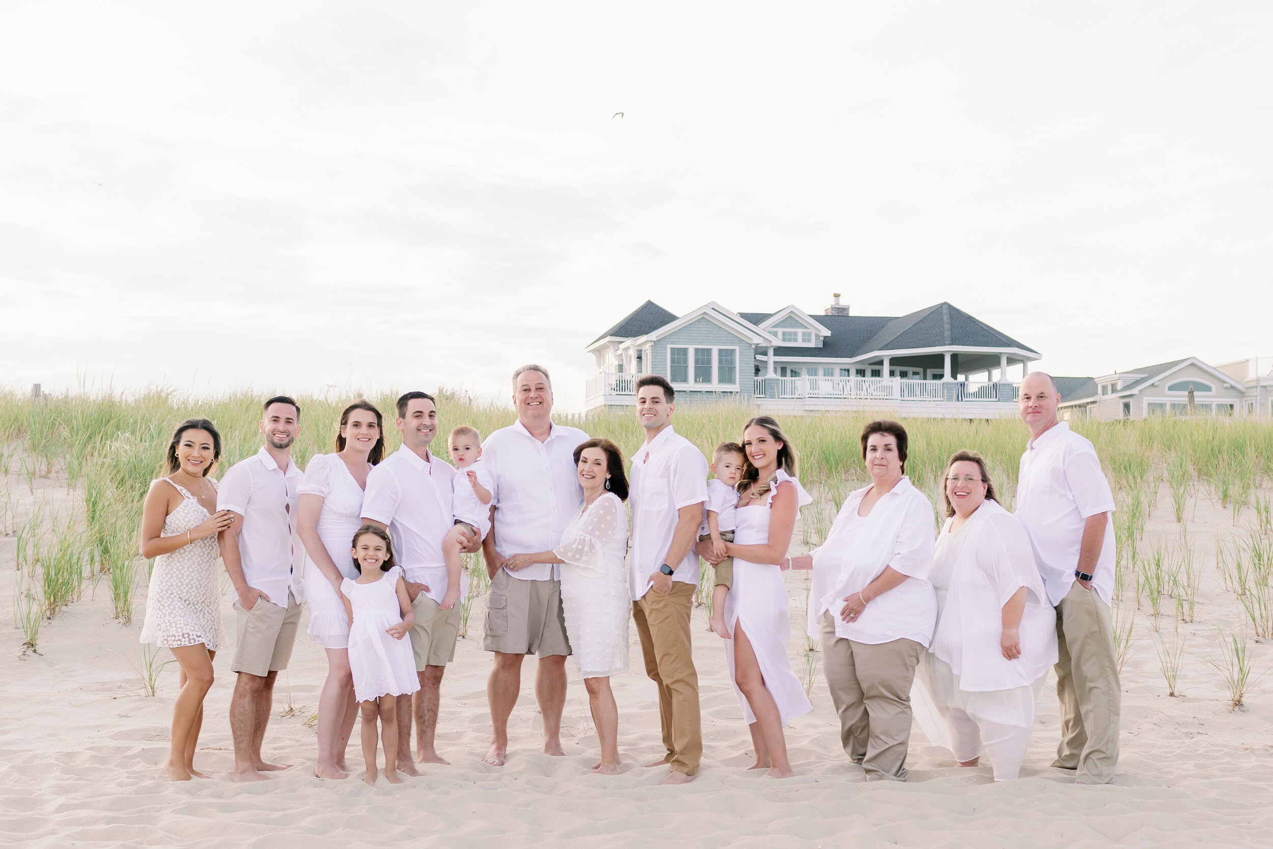Beach photo ideas: extended family wearing white for family beach photos | NKB Photo