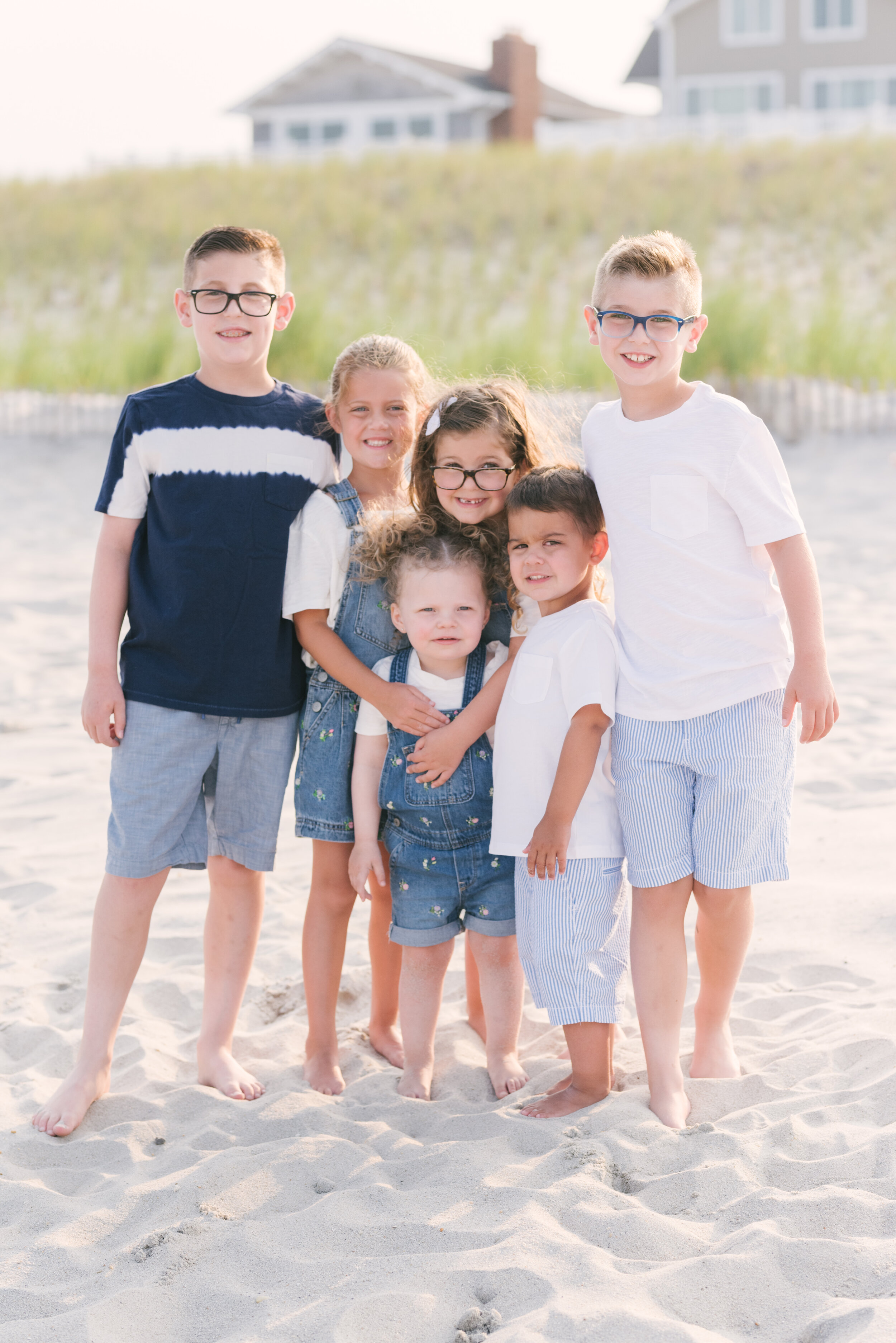 Cousins standing next to each other during beach photos  | NKB Photo