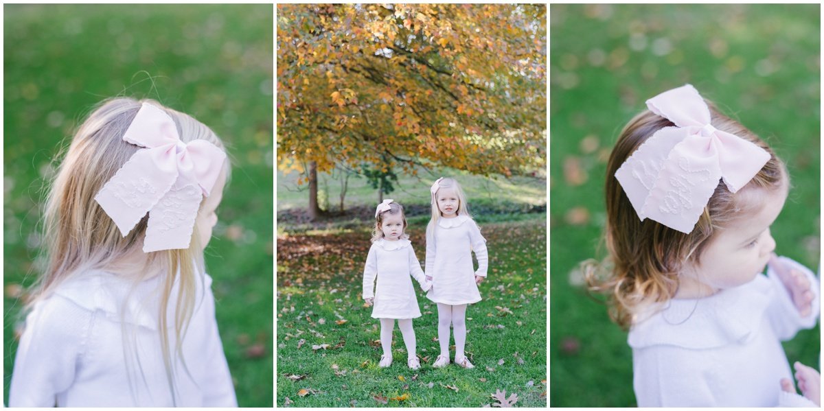Sisters wearing bows and holding hands during fall family photoshoot | NKB Photo