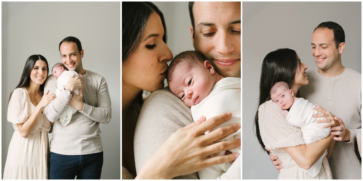 Dad and mom holding newborn baby on their shoulder  during session with Jupiter photographer | NKB Photo