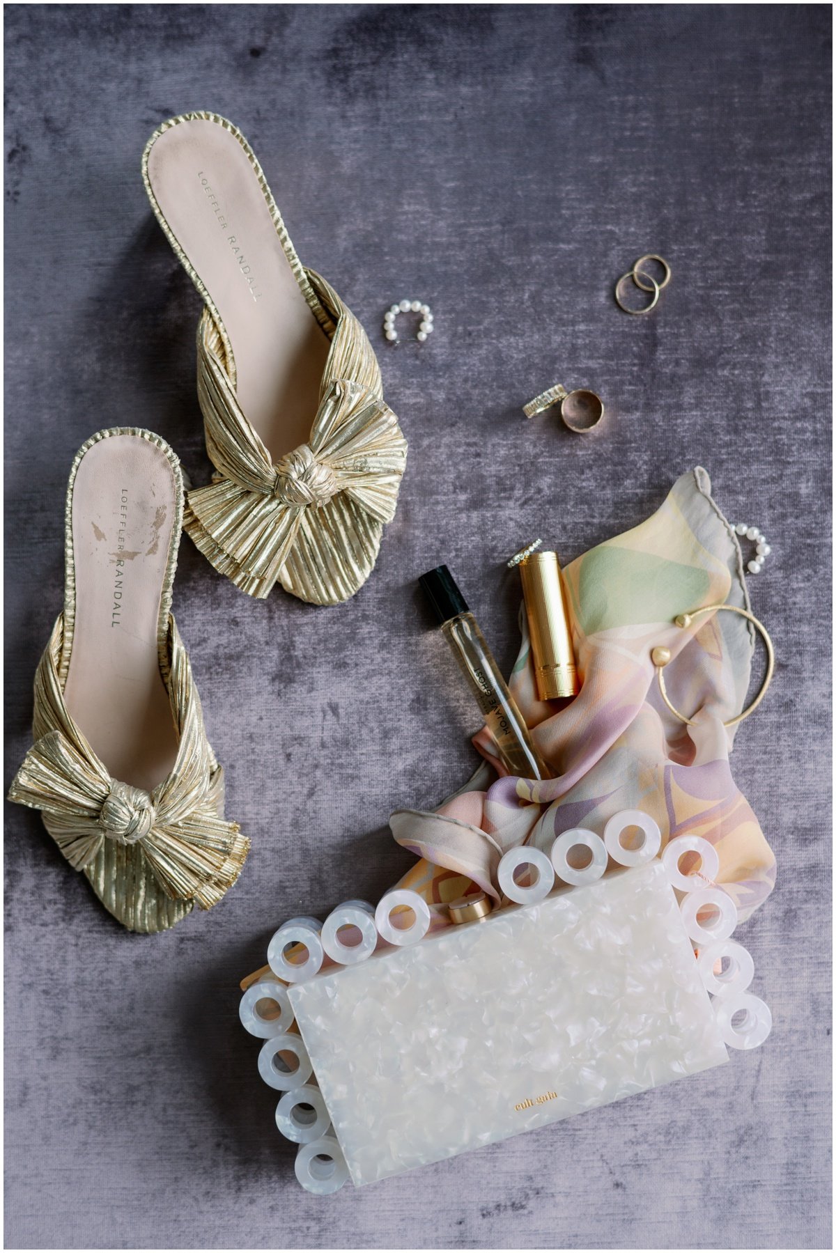 Pale green velvet shoes with white clutch and gold jewelry for styled shoot | NKB Photo