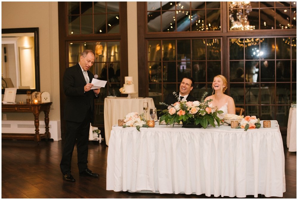 Bride and groom laughing during toast at Lake Mohawk Country Club Wedding | NKB Photo