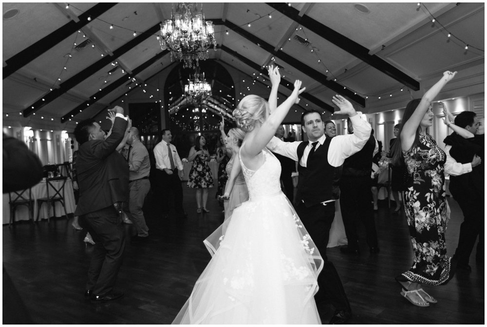 Bride and groom dancing with guests during reception at Lake Mohawk Country Club Wedding | NKB Photo
