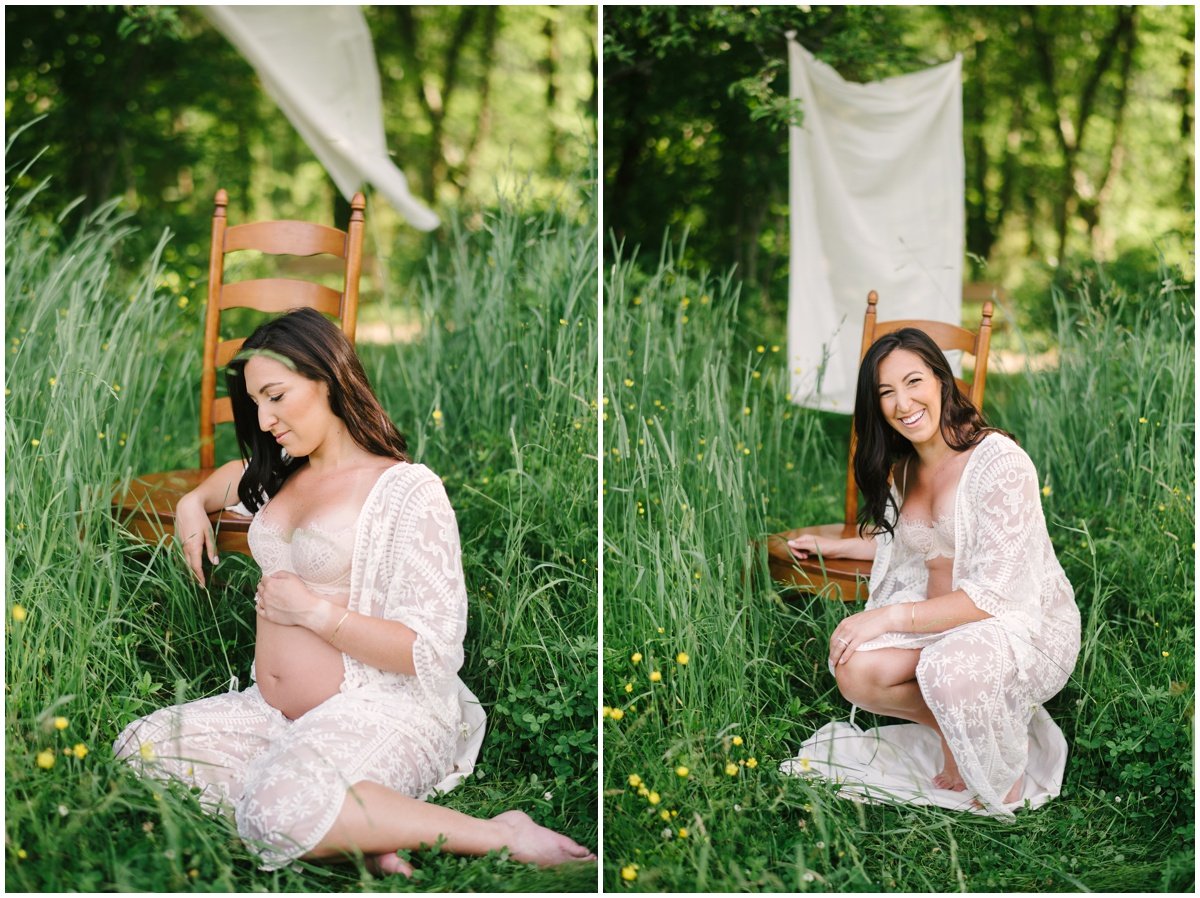 Pregnant woman sitting ing grassy field wearing white dress during maternity session | NKB Photo