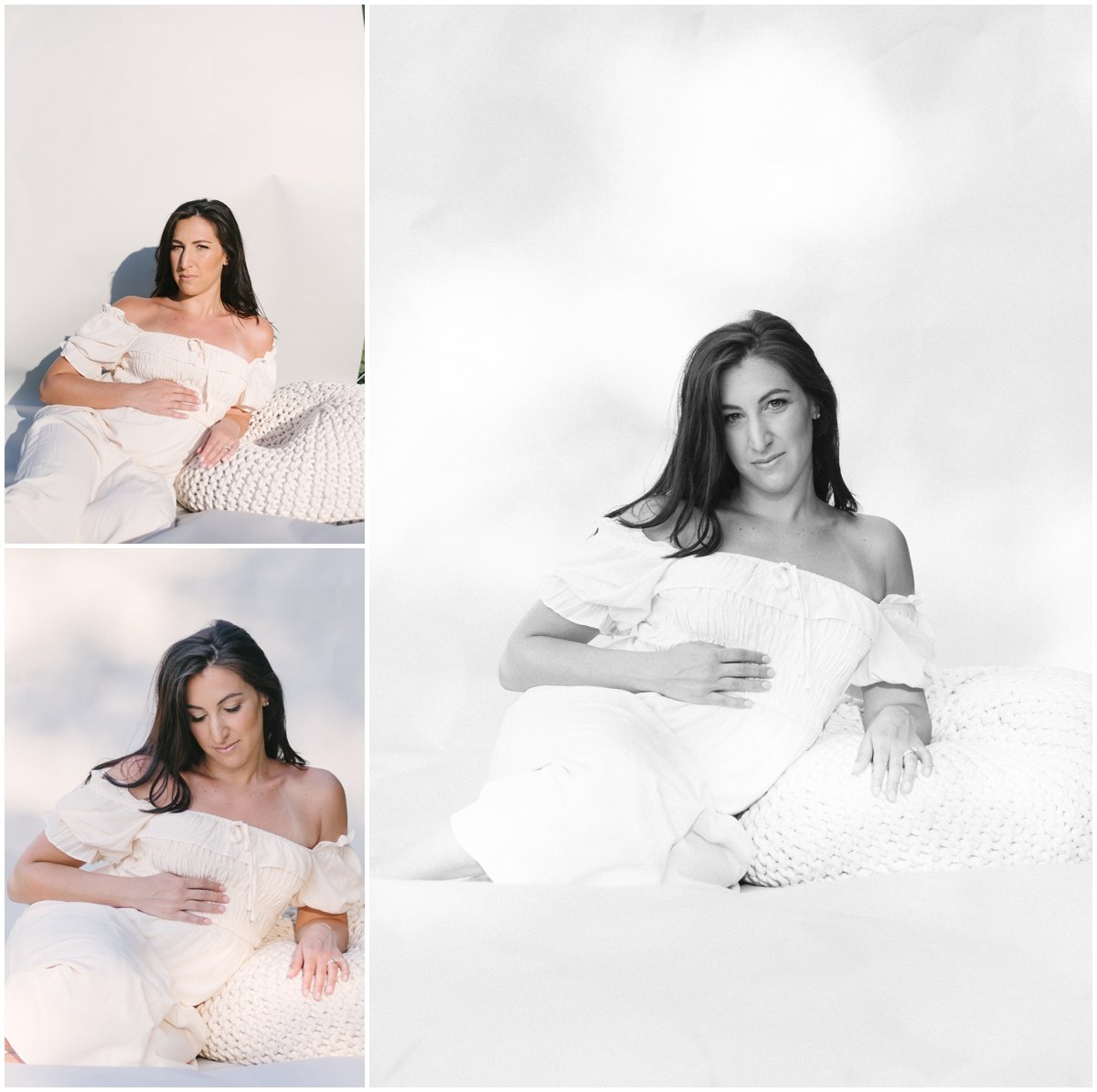 Woman sitting on bed wearing white flowy dress during maternity session | NKB Photo
