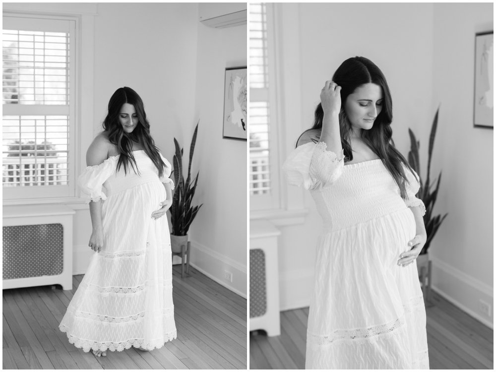 Mom in flowy white dress in nursery during maternity session with West Palm Beach maternity photographer | NKB Photo