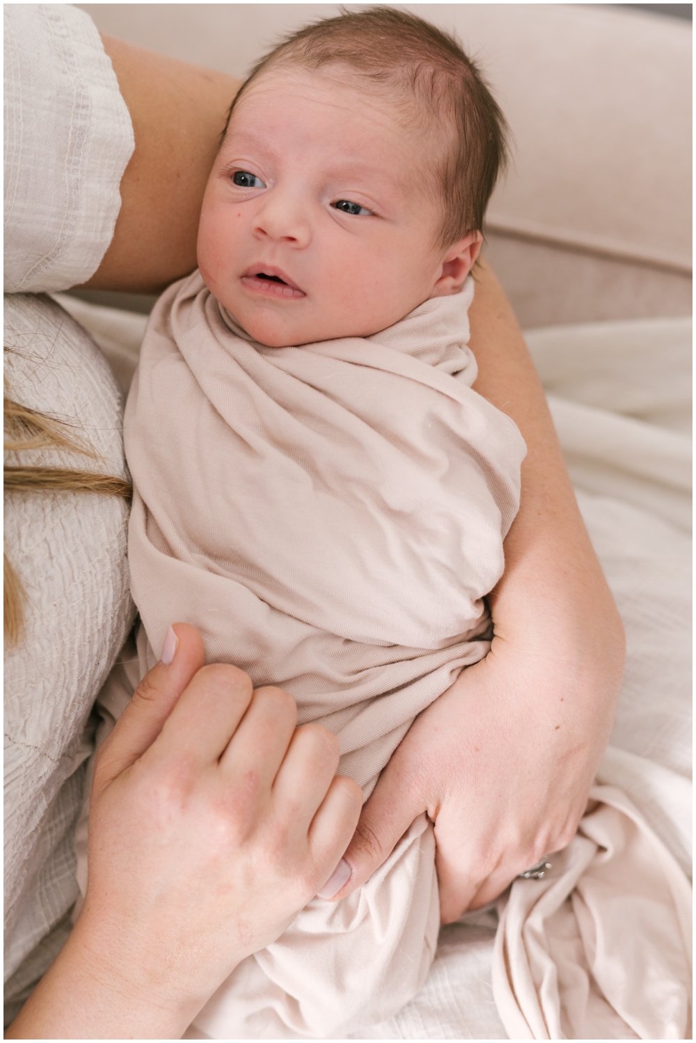 Alert newborn looking up during session | NKB Photo