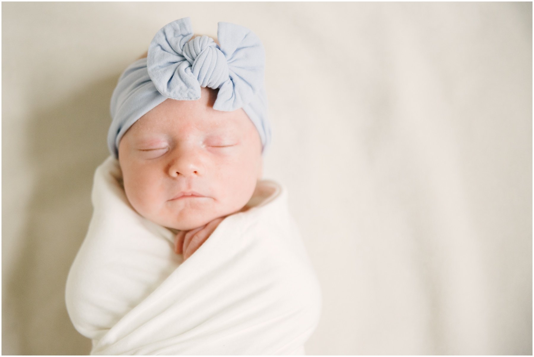 Baby swaddled with turban on during newborn session | NKB Photo