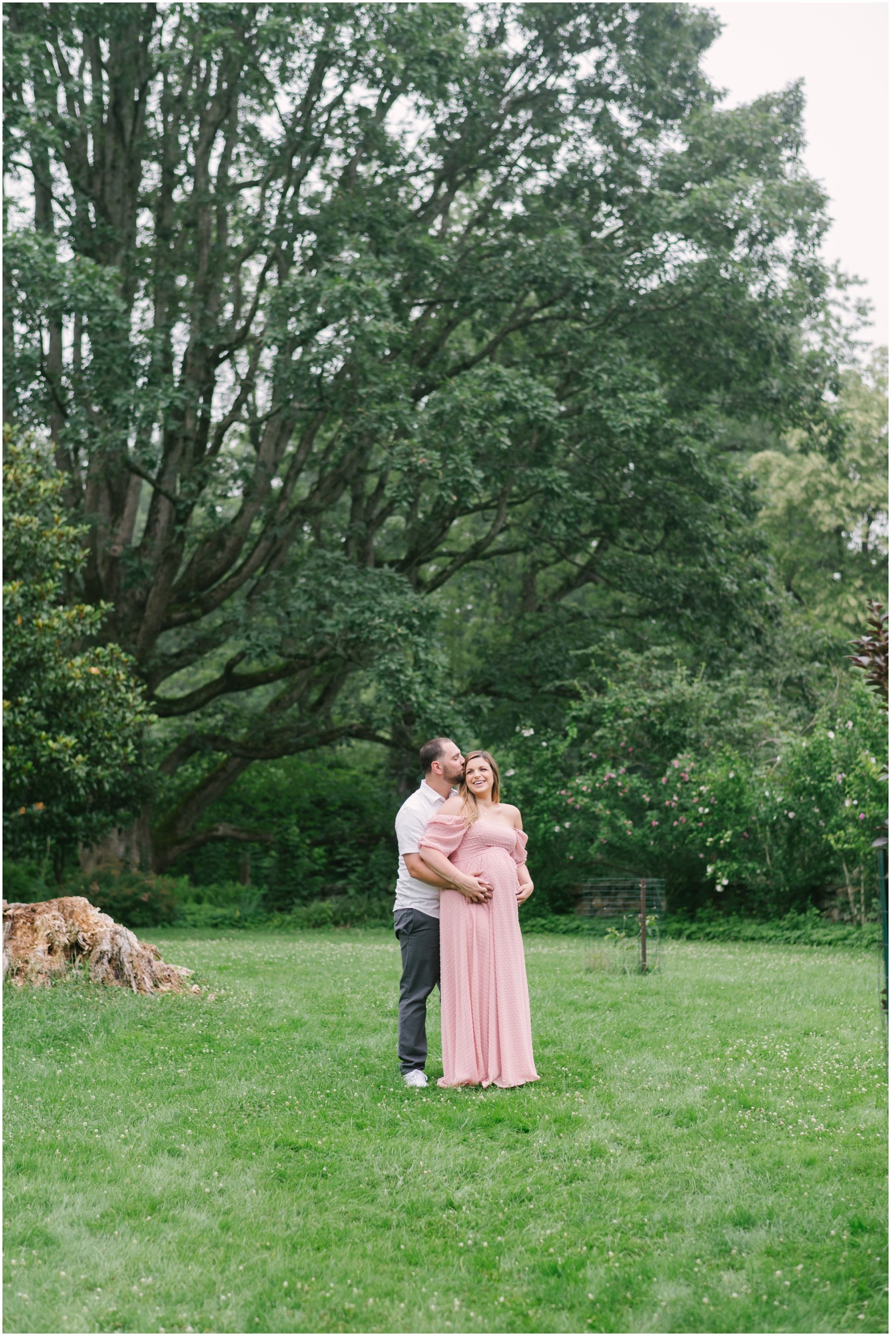 Man cradling pregnant belly during maternity session | NKB Photo