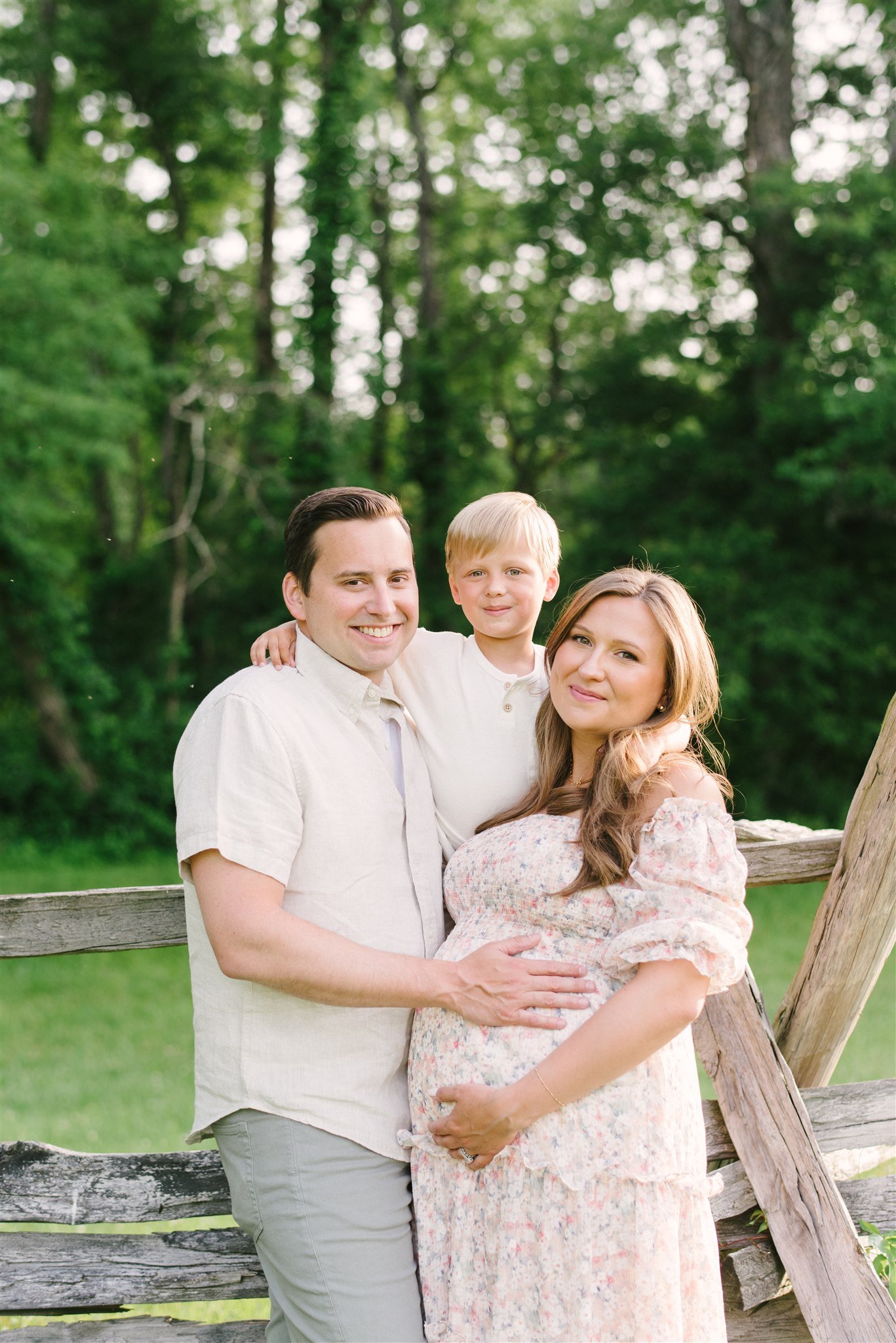 Pregnant woman with husband and son during maternity session