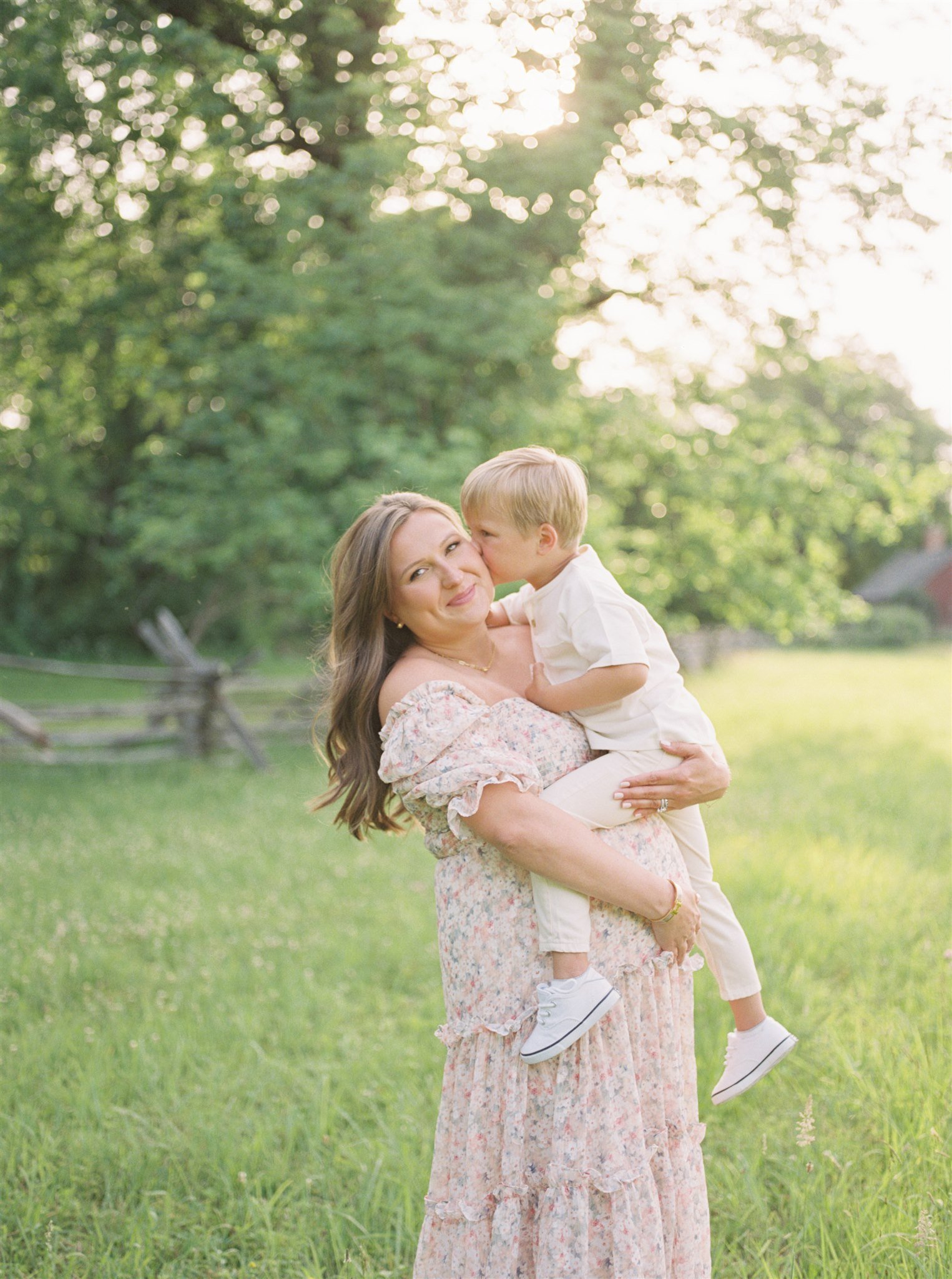 Pregnant woman holding young son during Miami maternity session