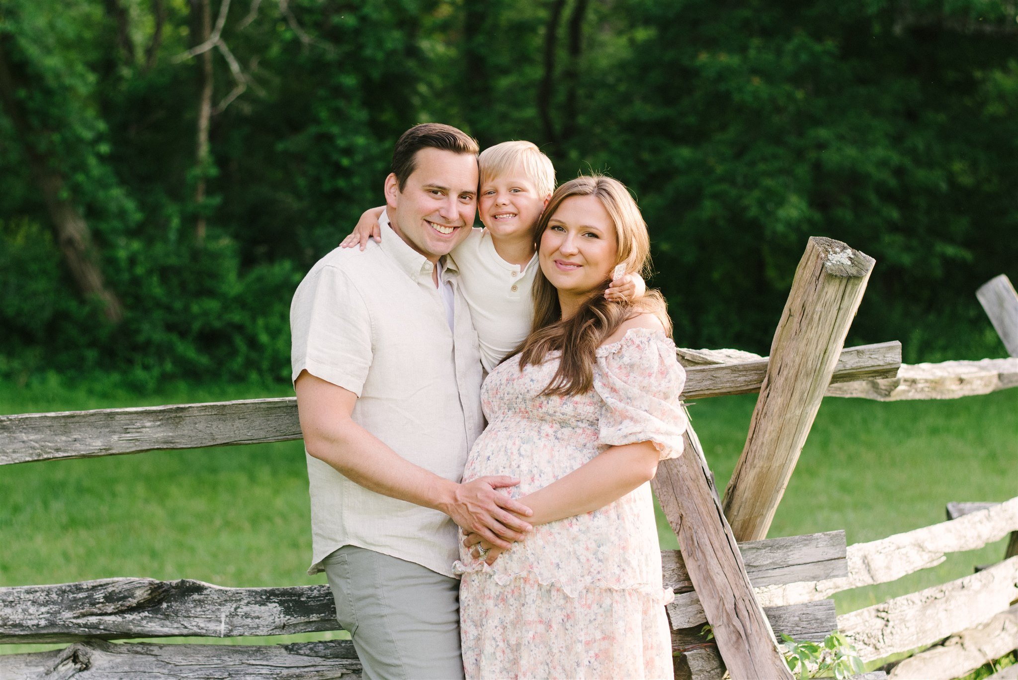 Pregnant woman with husband and son during maternity session