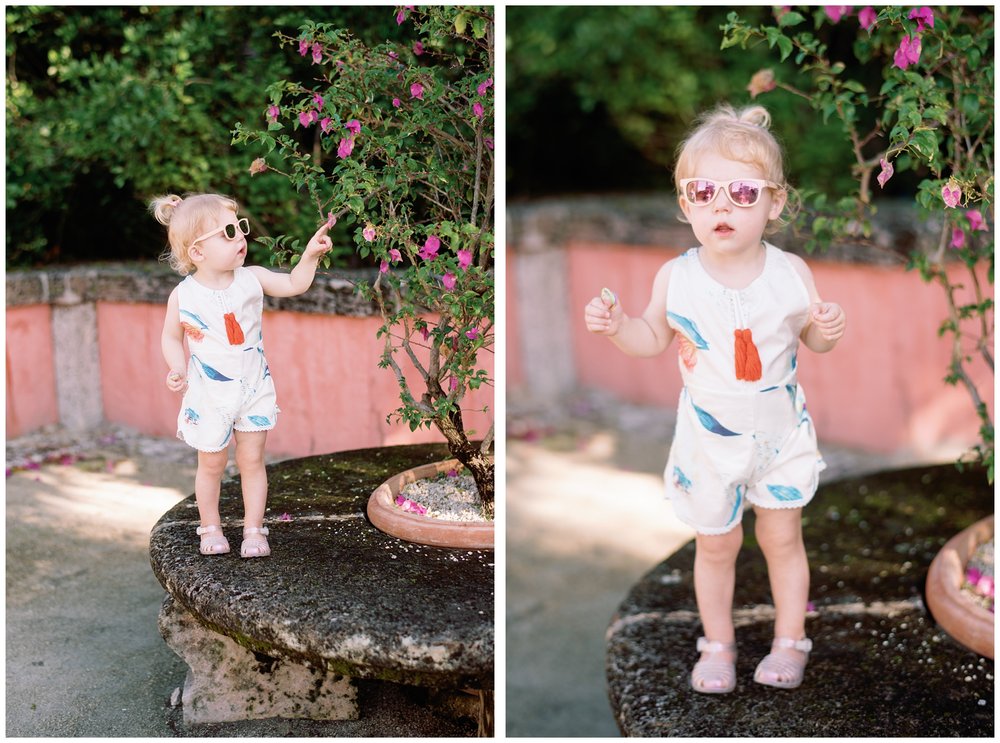 Toddler girl wearing sunglasses during session with Miami photographer | NKB Photo