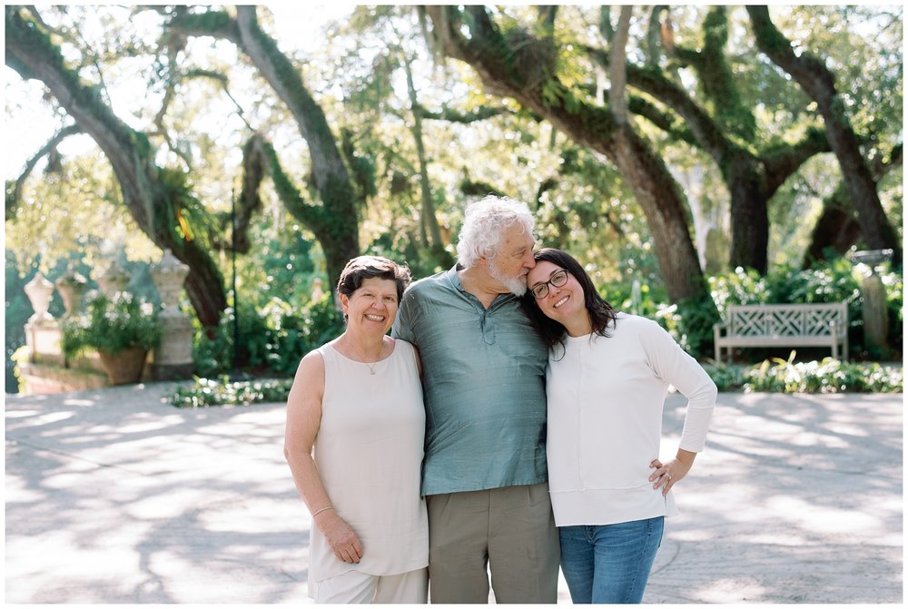 Daughter with parents at Vizcaya during session with Miami photographer | NKB Photo