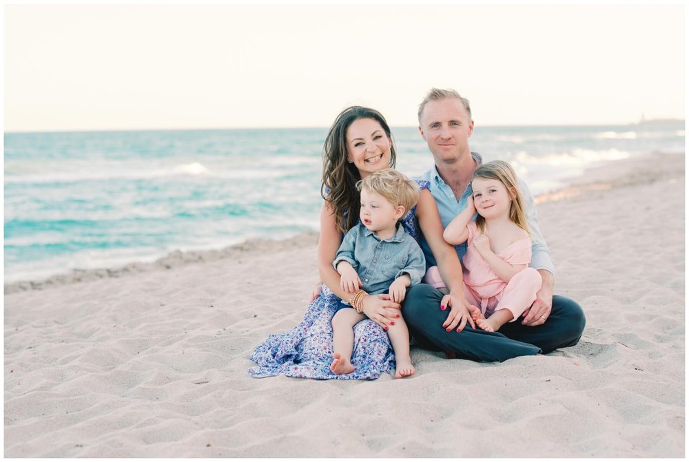 Family sitting on beach during session with Boca Raton Photographer