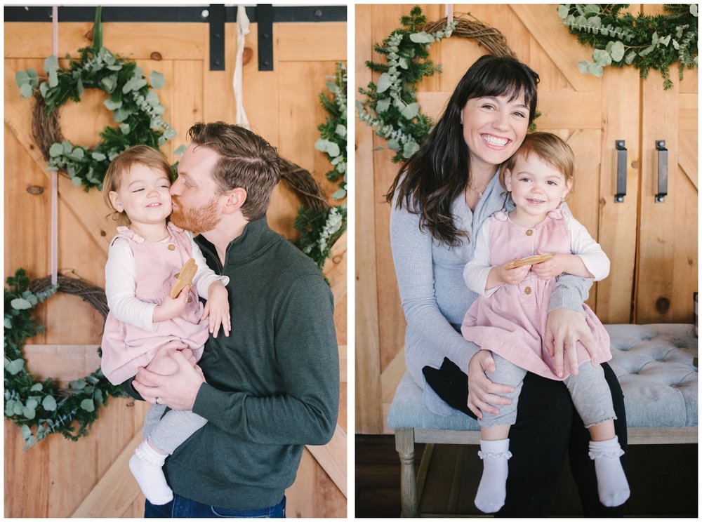Mom and dad holding toddler in holiday photos
