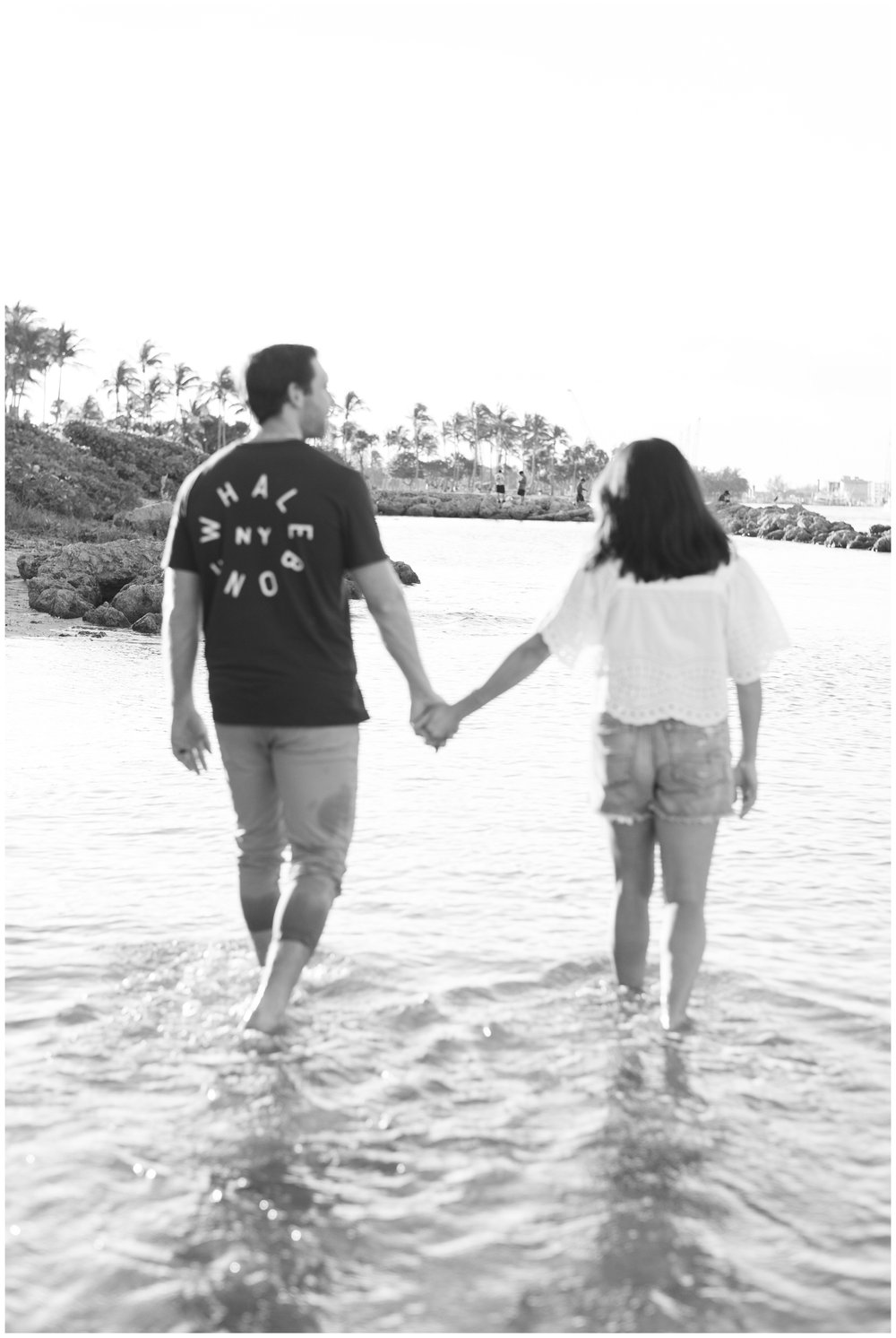 Husband and wife holding hands and walking on beach in Jupiter, FL | NKB Photo