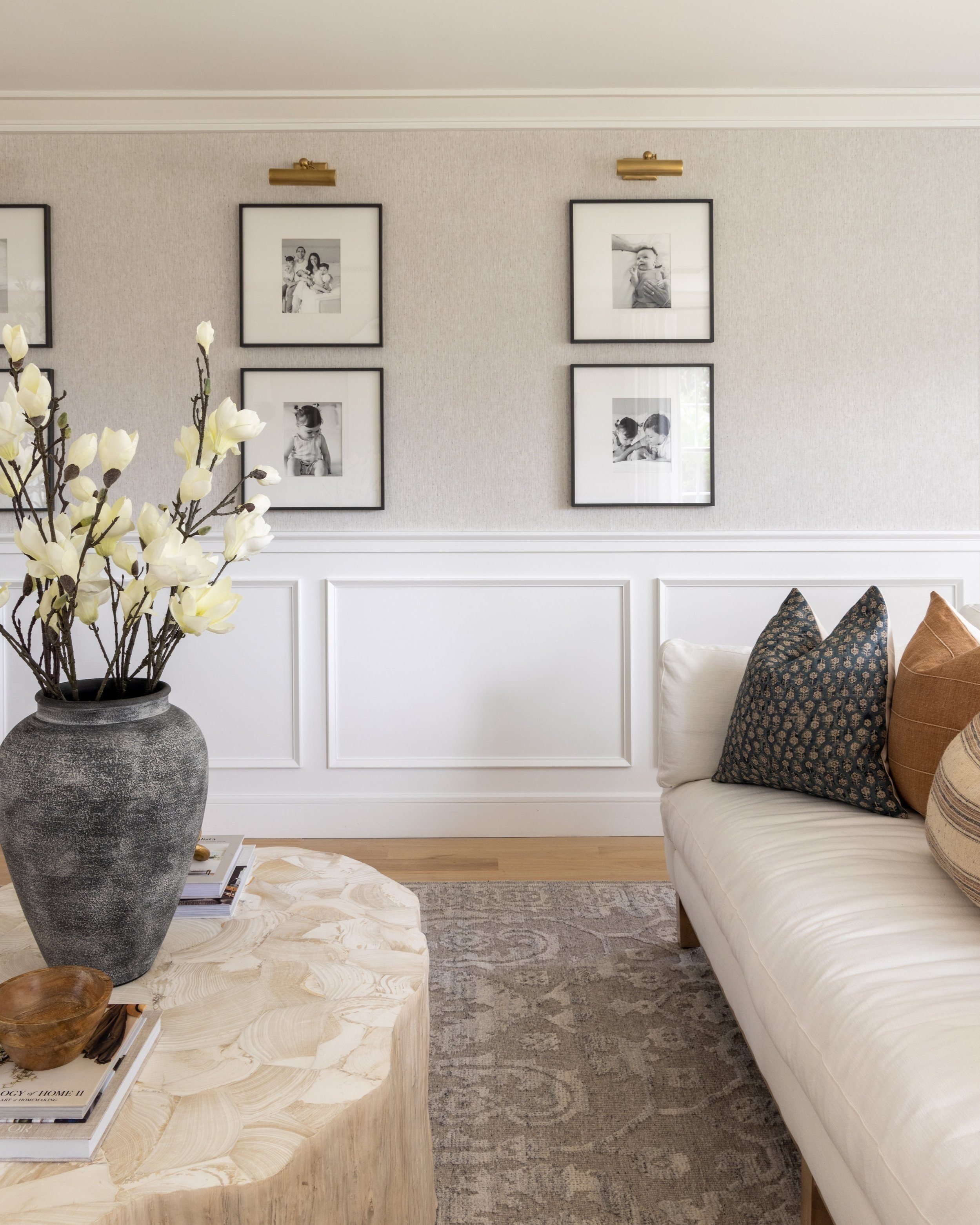 A finished gallery wall of newborn images in parkland florida