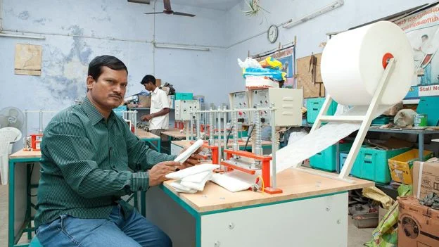 Muruganantham at one of his machines