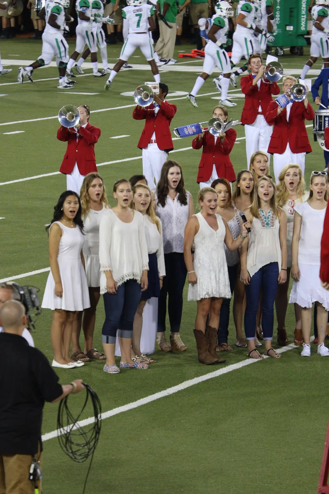The SMU Meadows Choirs performed "America, the Beautiful" at an SMU football game in remembrance of 9/11.