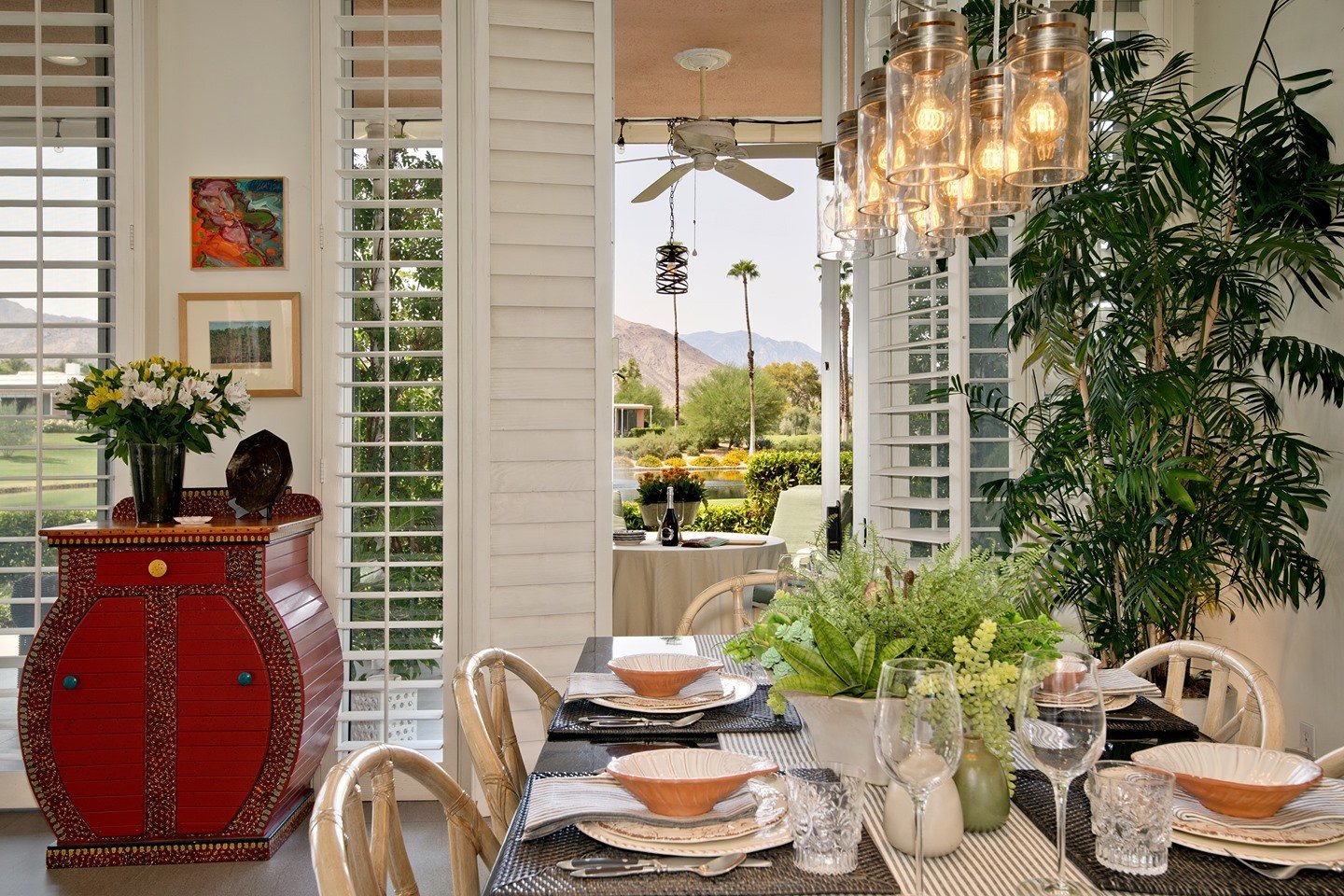 Natural Light + Vibrant tones make for an inviting dining room!