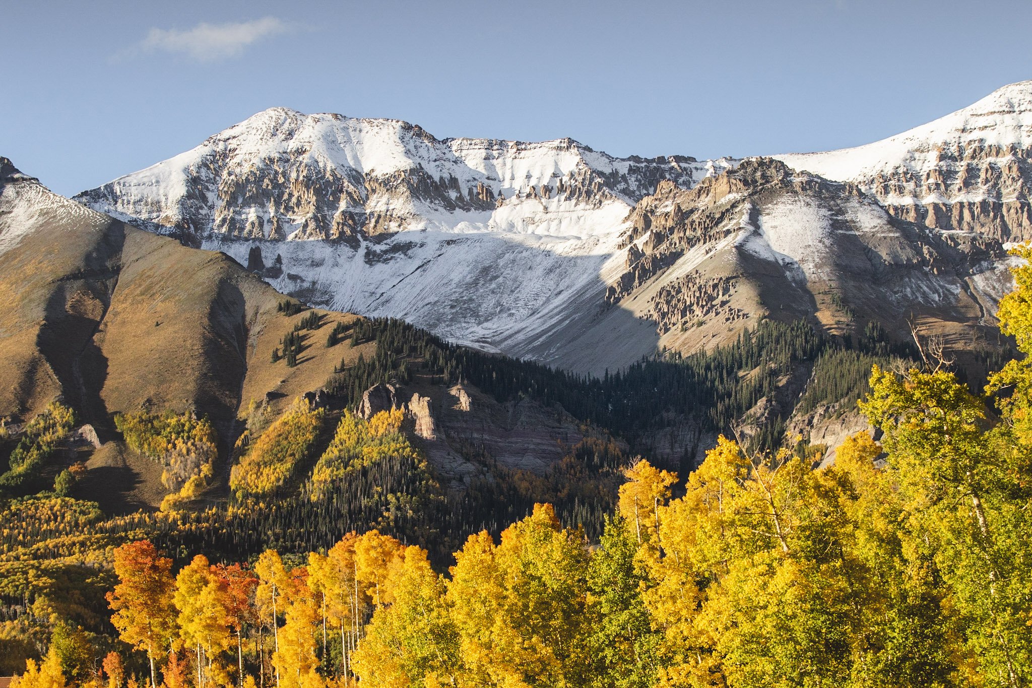Fall picture from gondola plaza mountain village toward snow and yellow aspen leaves
