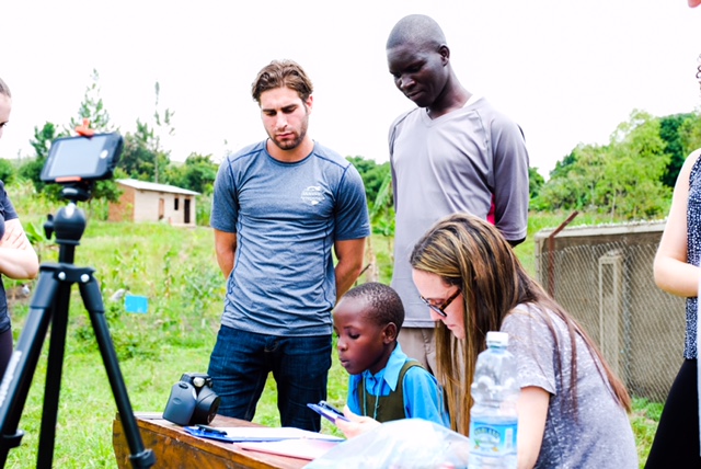 Michelle Gilman collects baseline data for our Global Reading Program while teaching other volunteers how to objectivley conduct these tests. 