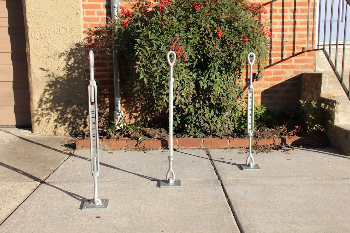 Sidewalk mounted bike station locks and racks can be mounted in group configurations.
