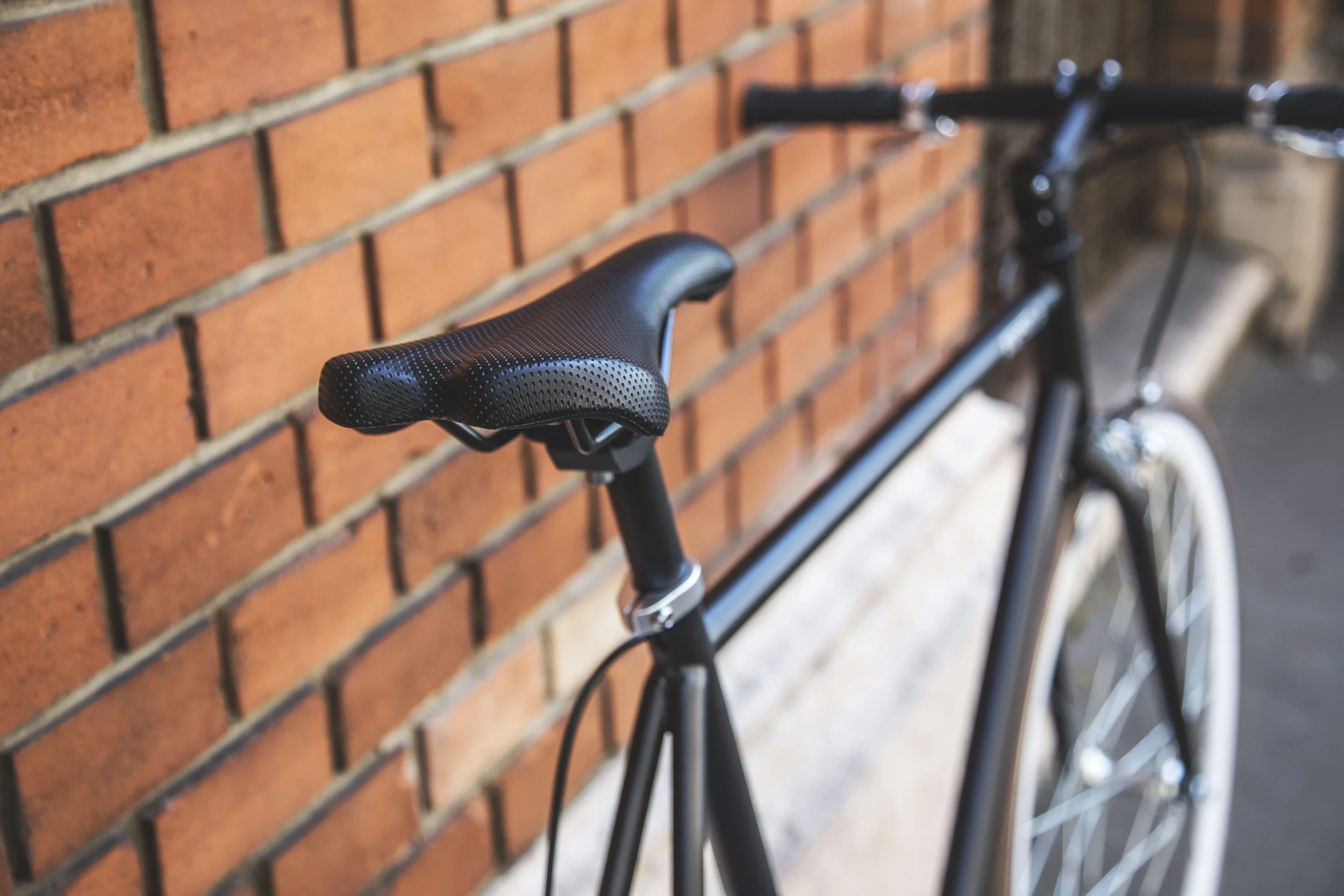 Image - Black Bicycle With a Brick Wall (Echelon PR.jpeg
