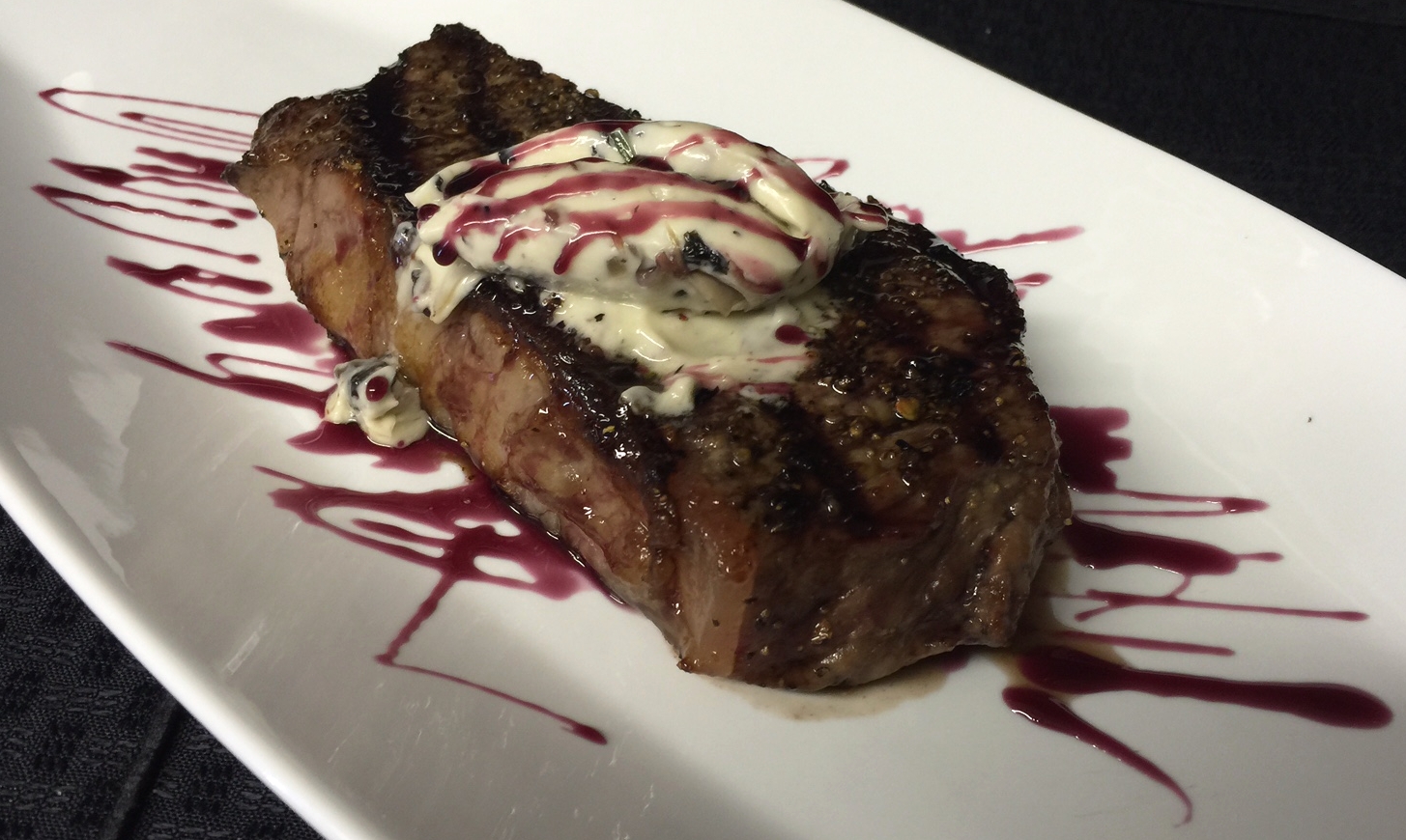 New York Strip with Mushroom Compound Butter & Red Wine Reduction