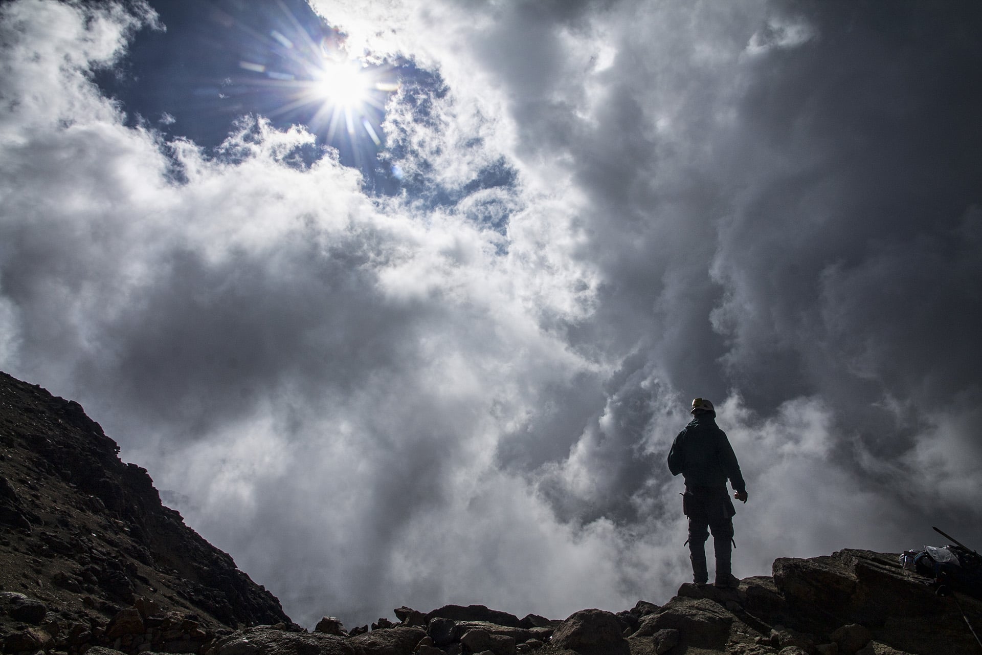  Cresting another ridge, we catch a glimpse of base camp. Another team of mountain rescue volunteers is busy radioing to colleagues higher on the mountain. Airy white clouds form on the western flanks of Iztaccihuatl. Knowing the team is going to lea