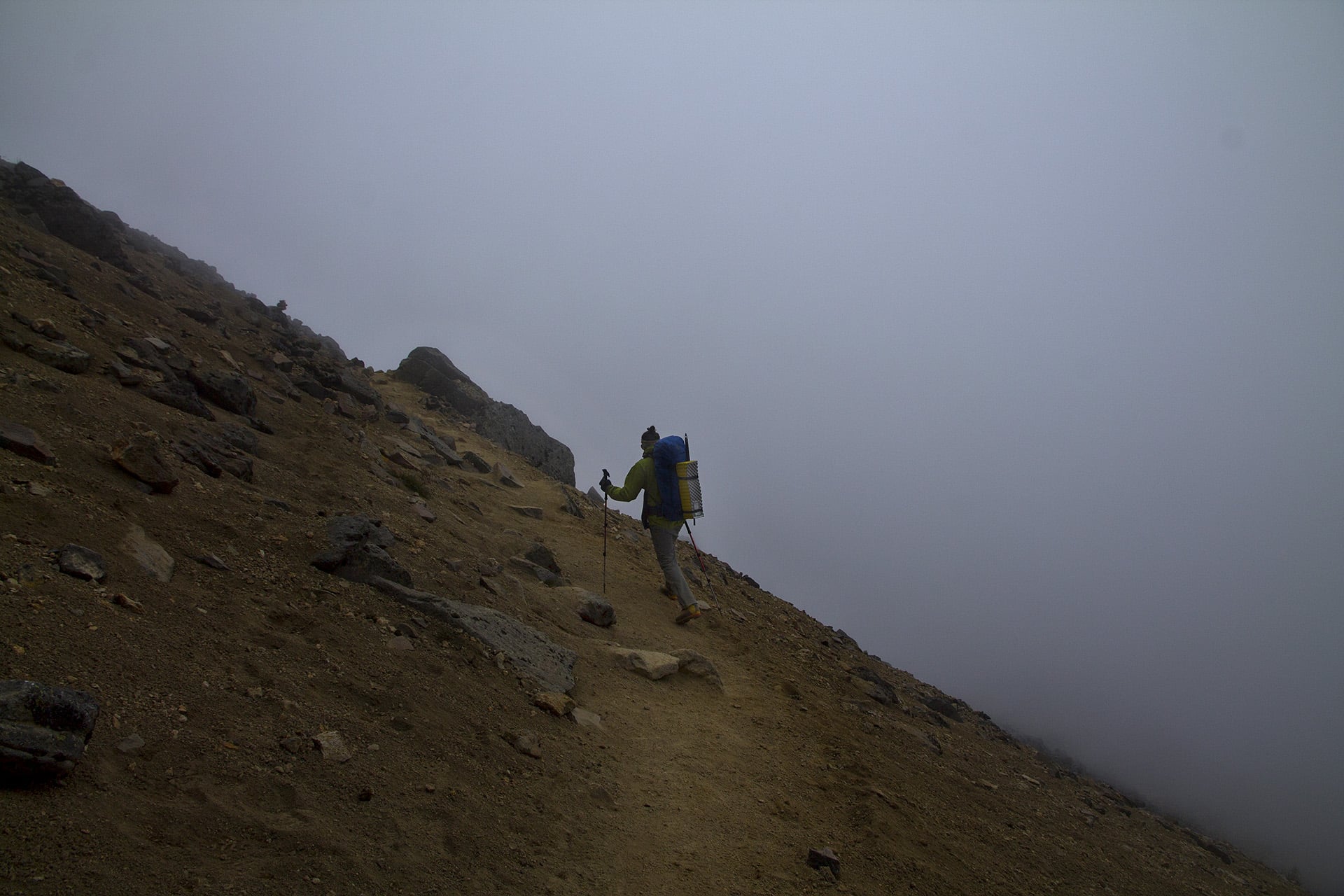  The darkening clouds make our descent muffled and uneventful. In the midst of the clouds we meet a Czech couple on a day hike. They’ve arranged for a taxi to wait for them at the trailhead, which is a great opportunity to hitch a ride, since no one 