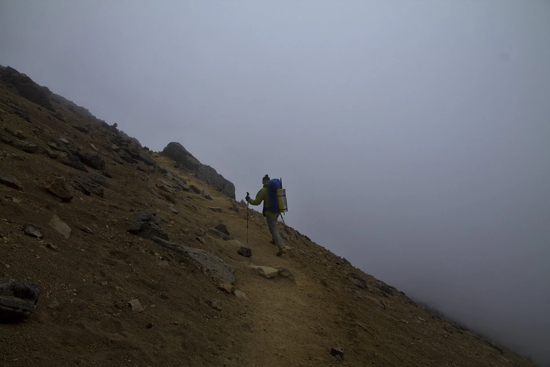 The darkening clouds make our descent muffled and uneventful. In the midst of the clouds we meet a Czech couple on a day hike. They’ve arranged for a taxi to wait for them at the trailhead, which is a great opportunity to hitch a ride, since no one is waiting for us. The haggling that undoubtedly awaits me is something that years of travel have adequately prepared me for. I relish it. 