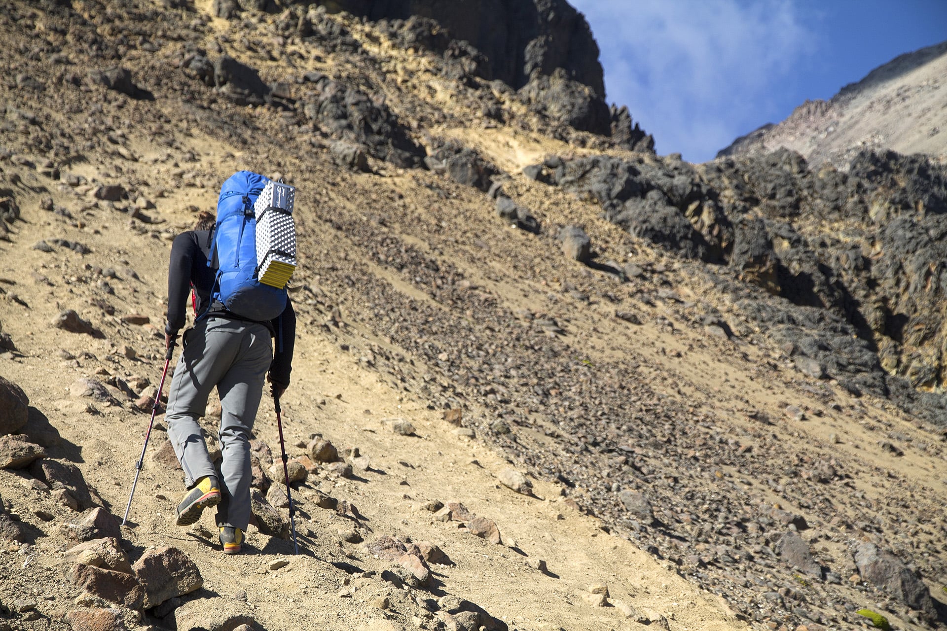 Jordan and I sometimes have long stretches where no words are exchanged. Mountains and travel have a way of inducing silence and hushing sentiments. As he trudges upwards, however, I express my gratitude with a few simple words. A capable climbing p