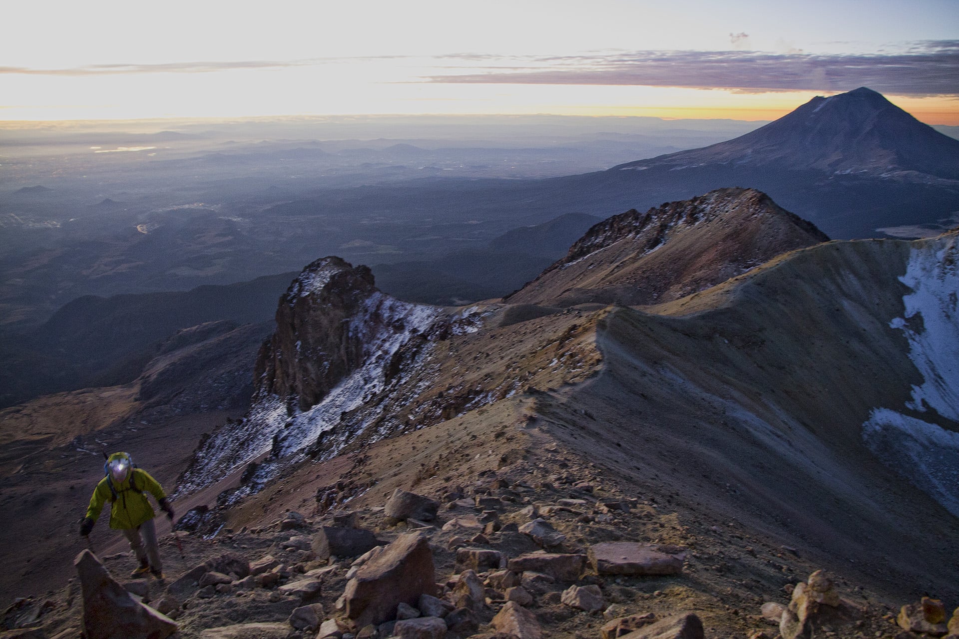  A late alpine start at 3:30am speaks to our confidence in being able to get up to the summit and back down without much of an issue. Luckily the wind has died down, but the twilight air is still cold enough to cause a throbbing numbness in our toes 