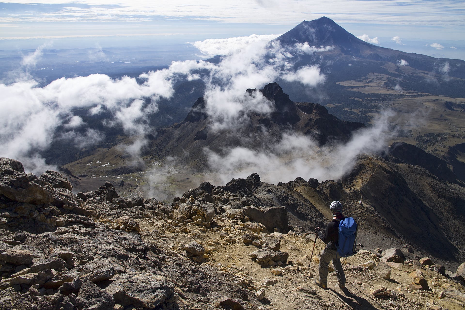 We had monitored reports of a weather system forecasted to bear down on the region for some days prior to our ascent. Making our way back to the hut, we see that clouds are forming over the range much earlier in the day than is typical. We’ve chosen