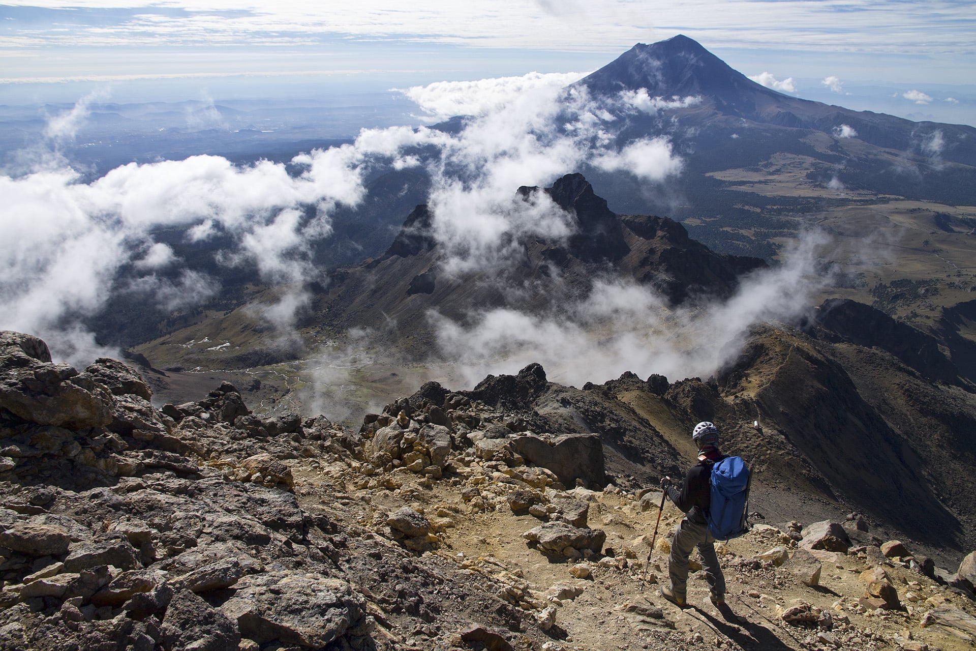  We had monitored reports of a weather system forecasted to bear down on the region for some days prior to our ascent. Making our way back to the hut, we see that clouds are forming over the range much earlier in the day than is typical. We’ve chosen