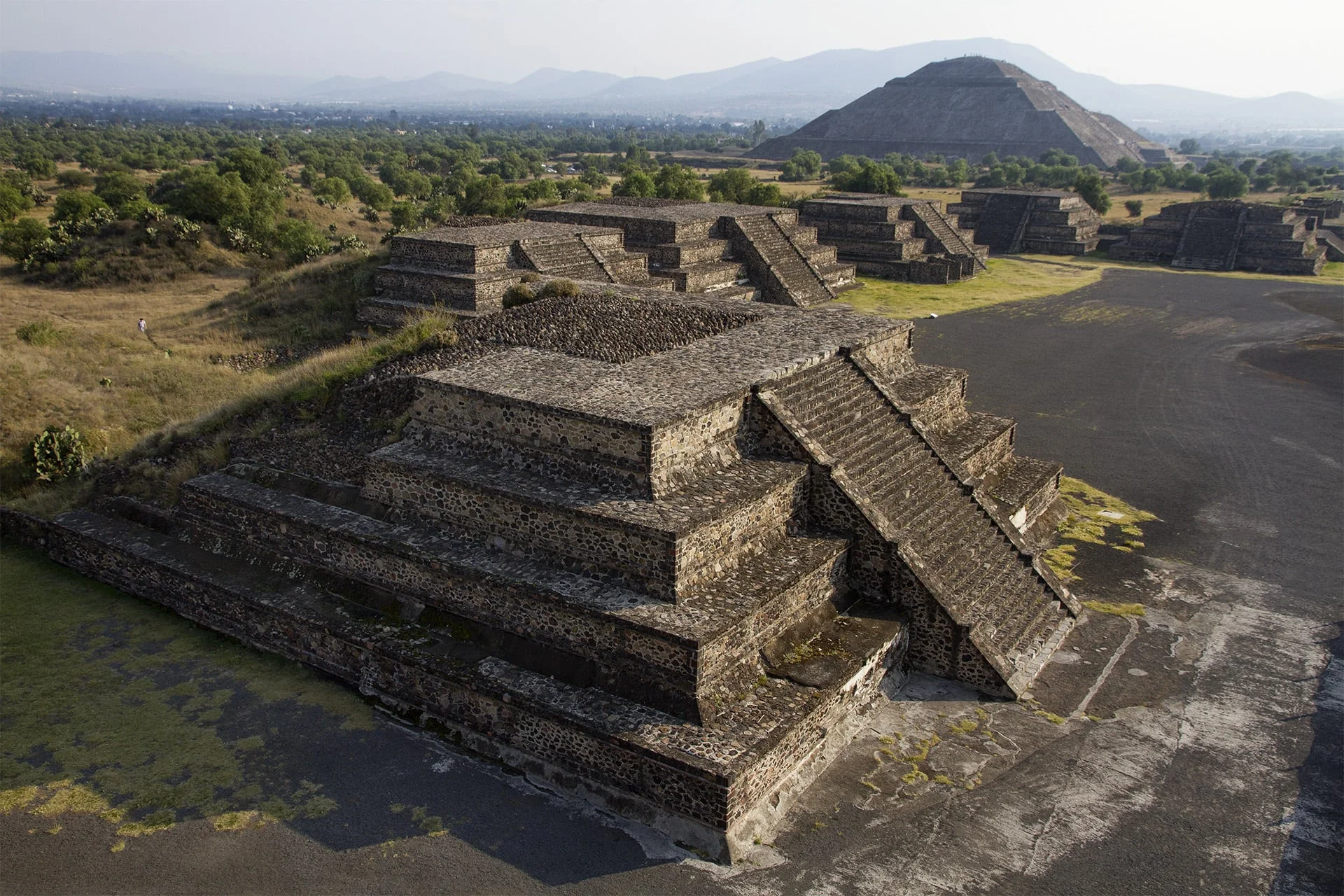Shadows grow long and streak away from the Mesoamerican pyramids.