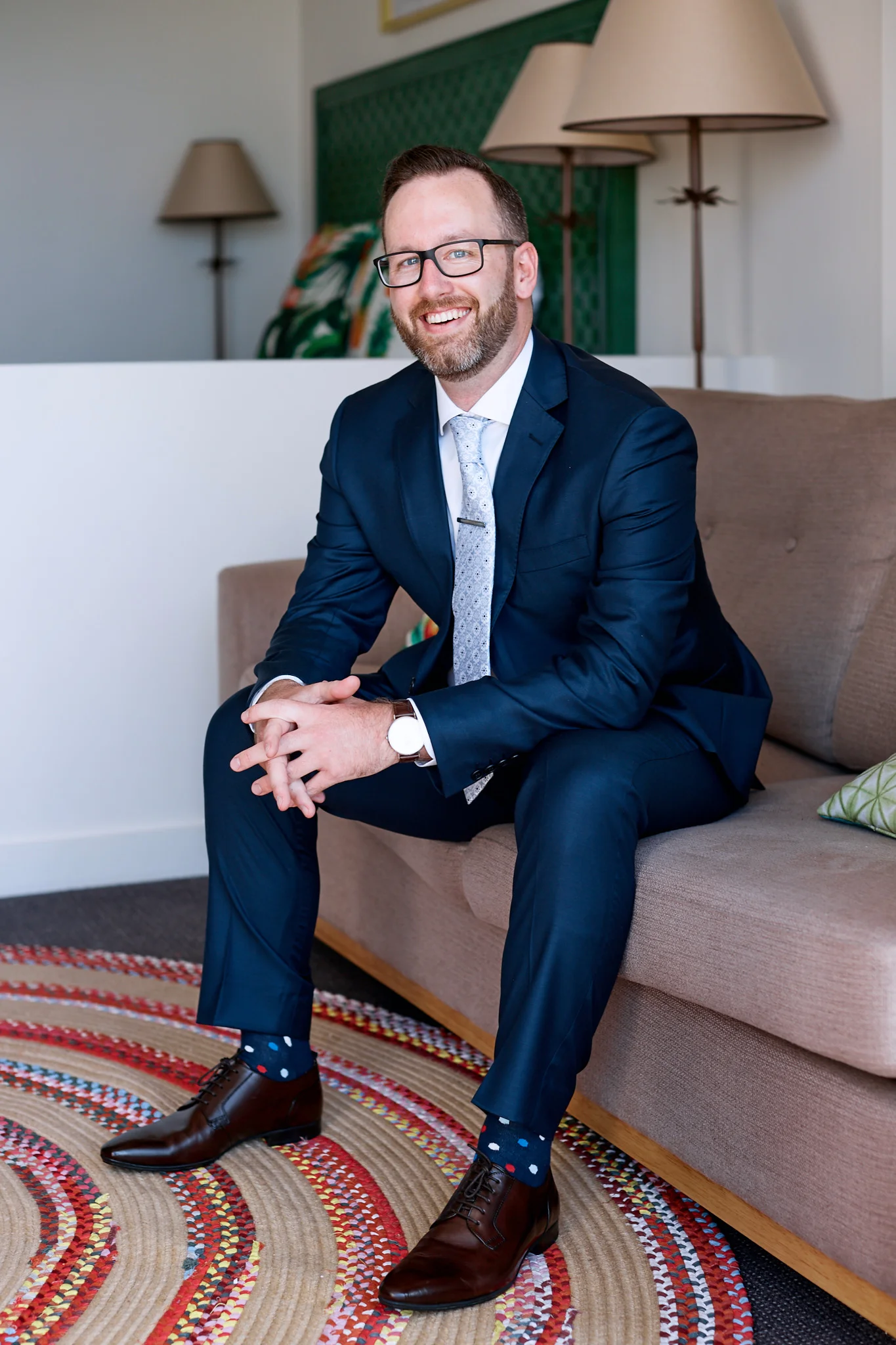 groom sitting in suit copy.jpg