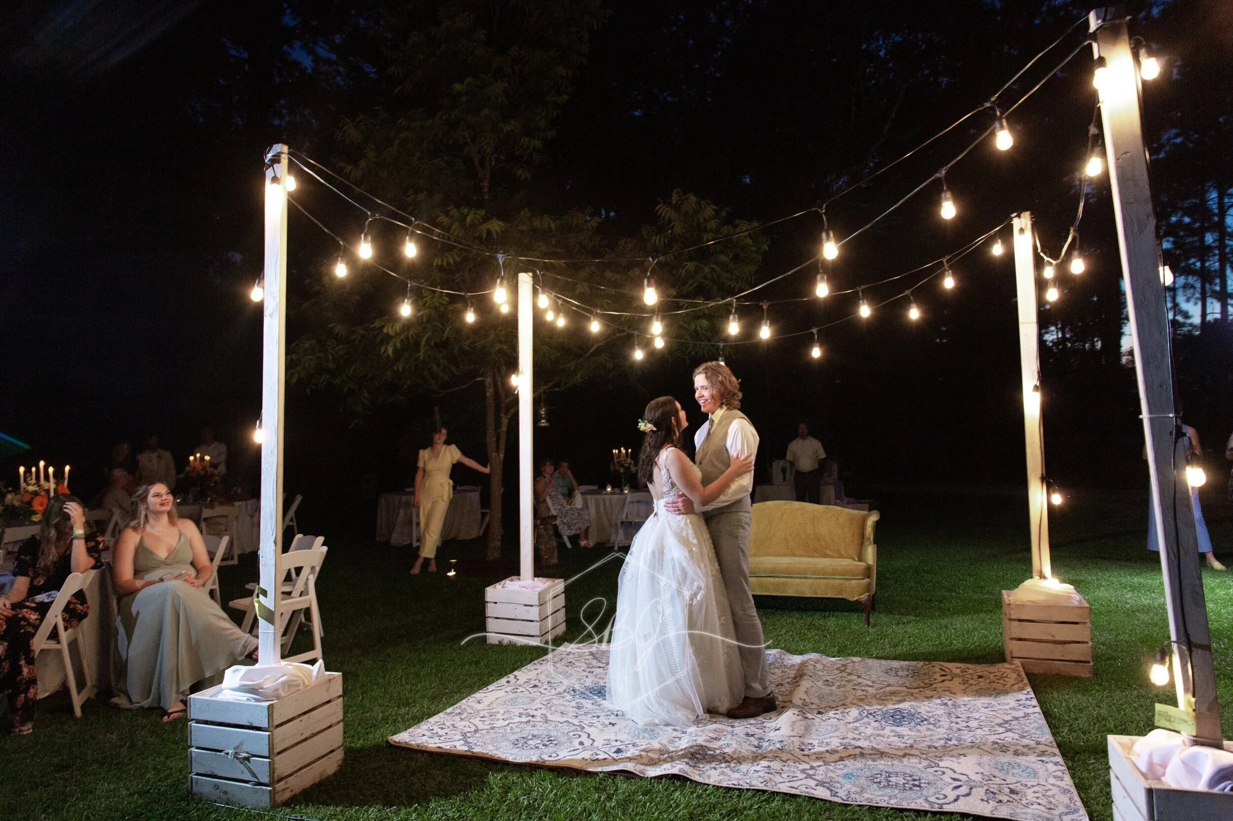 Wedding photography baton rouge new orleans backyard bride groom photographer photography videography photo booth louisiana bridal portrait the sentimental petal bouquet florals flowers infinity circular Arch arbor Bohemian first dance string lights