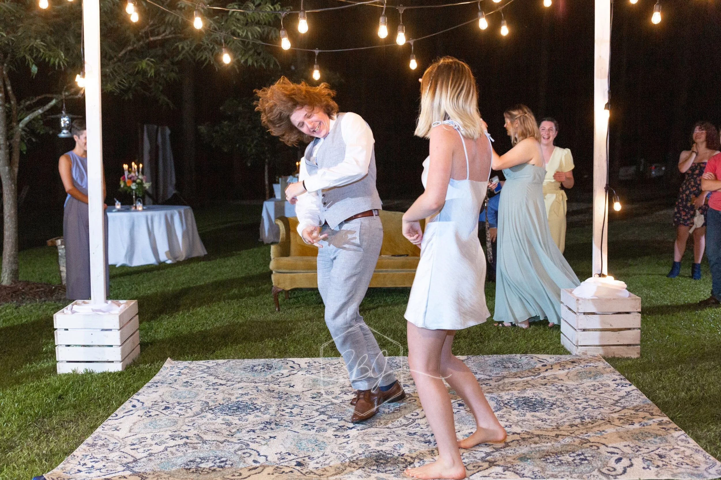 Wedding photography baton rouge new orleans backyard bride groom photographer photography videography photo booth louisiana bridal portrait the sentimental petal bouquet florals flowers infinity circular Arch arbor Reception fun dancing