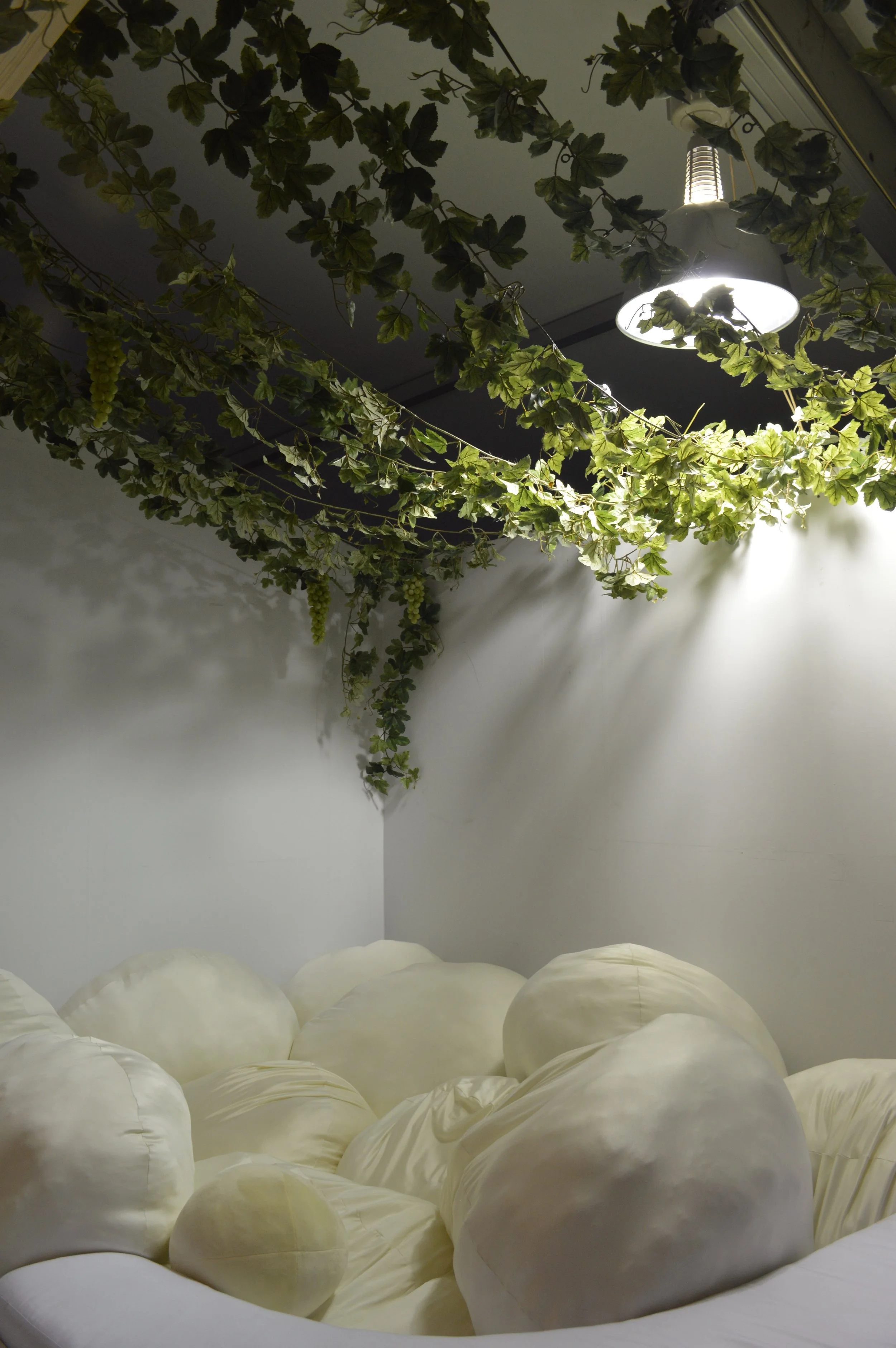 Howa-howa Komorebi Gym: This is a pillow pit with softly filtered sunlight. Sun shines through hanging vines into this soft cushion corner filled with egg-shaped squishy orbs, a place to lie, rest, and release the stresses of the city.
