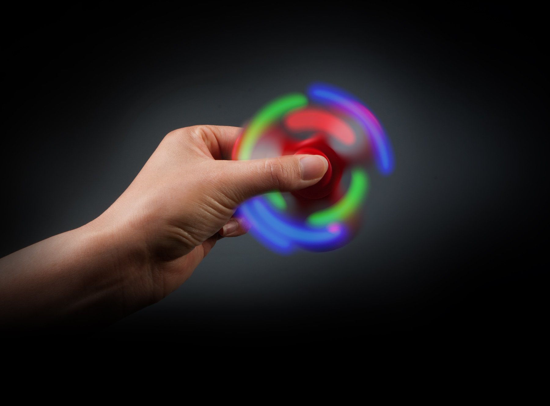 Photo used on fidget spinner display. A double exposure technique was used to capture the lighting effects. © E-filliate Inc.